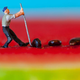 miniature statue of farmer tries to pull up watermelon seed